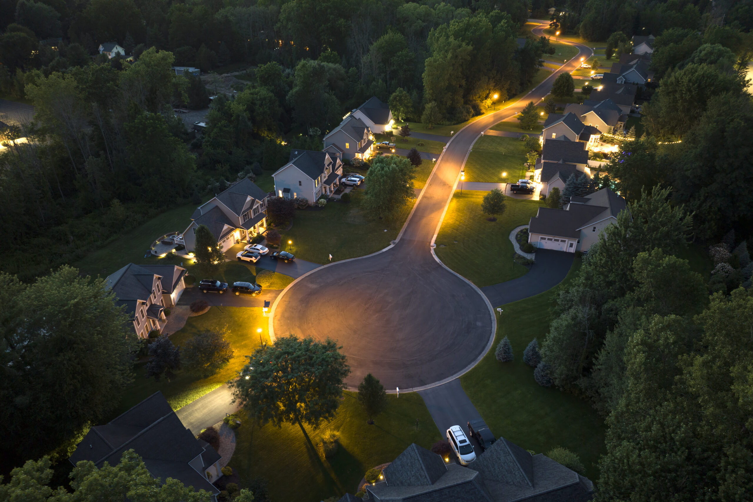 Spacious new single family homes in upstate New York residential area at night. Real estate development in american suburbs