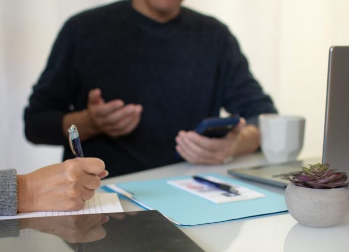 two-people-working-together-for-a-business-in-an-o-2024-12-02-03-13-53-utc